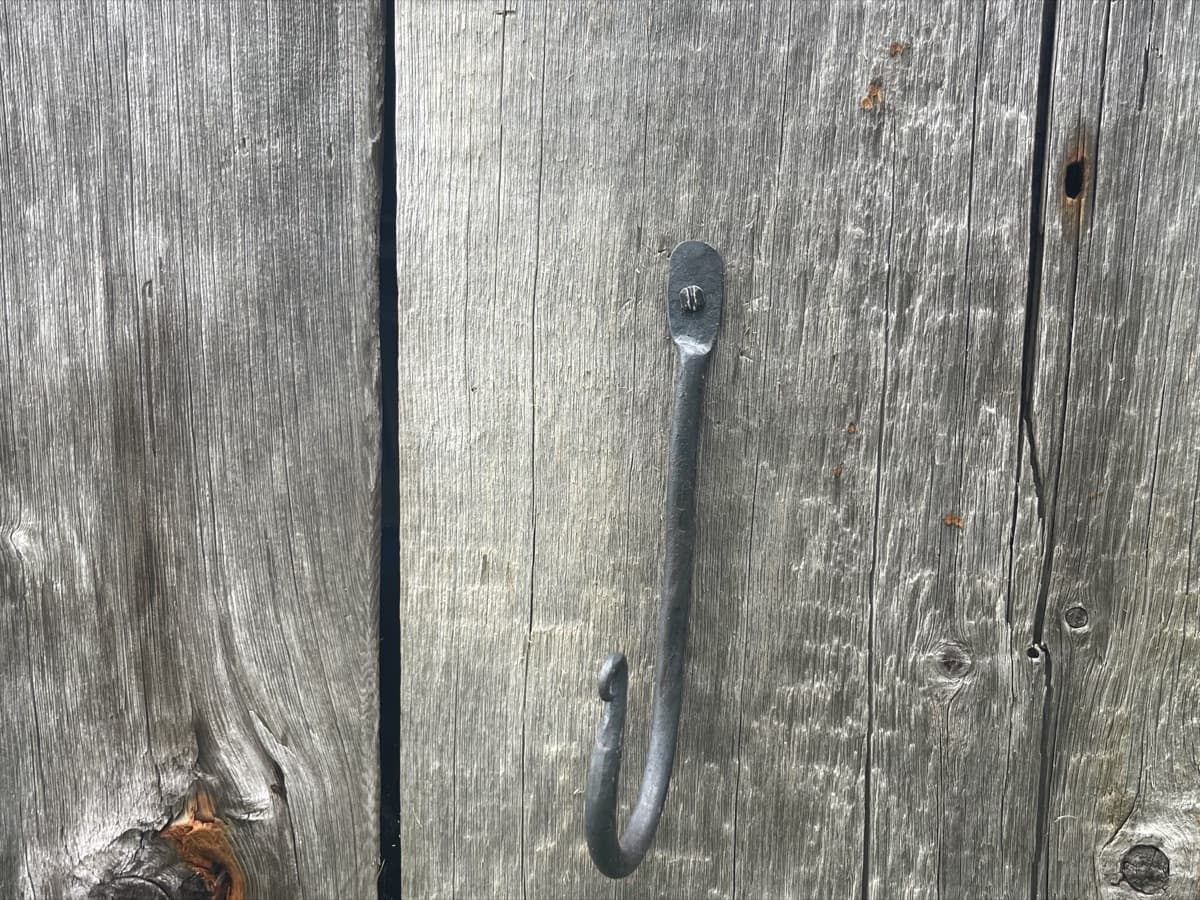A large hand-forged wrought-iron hook