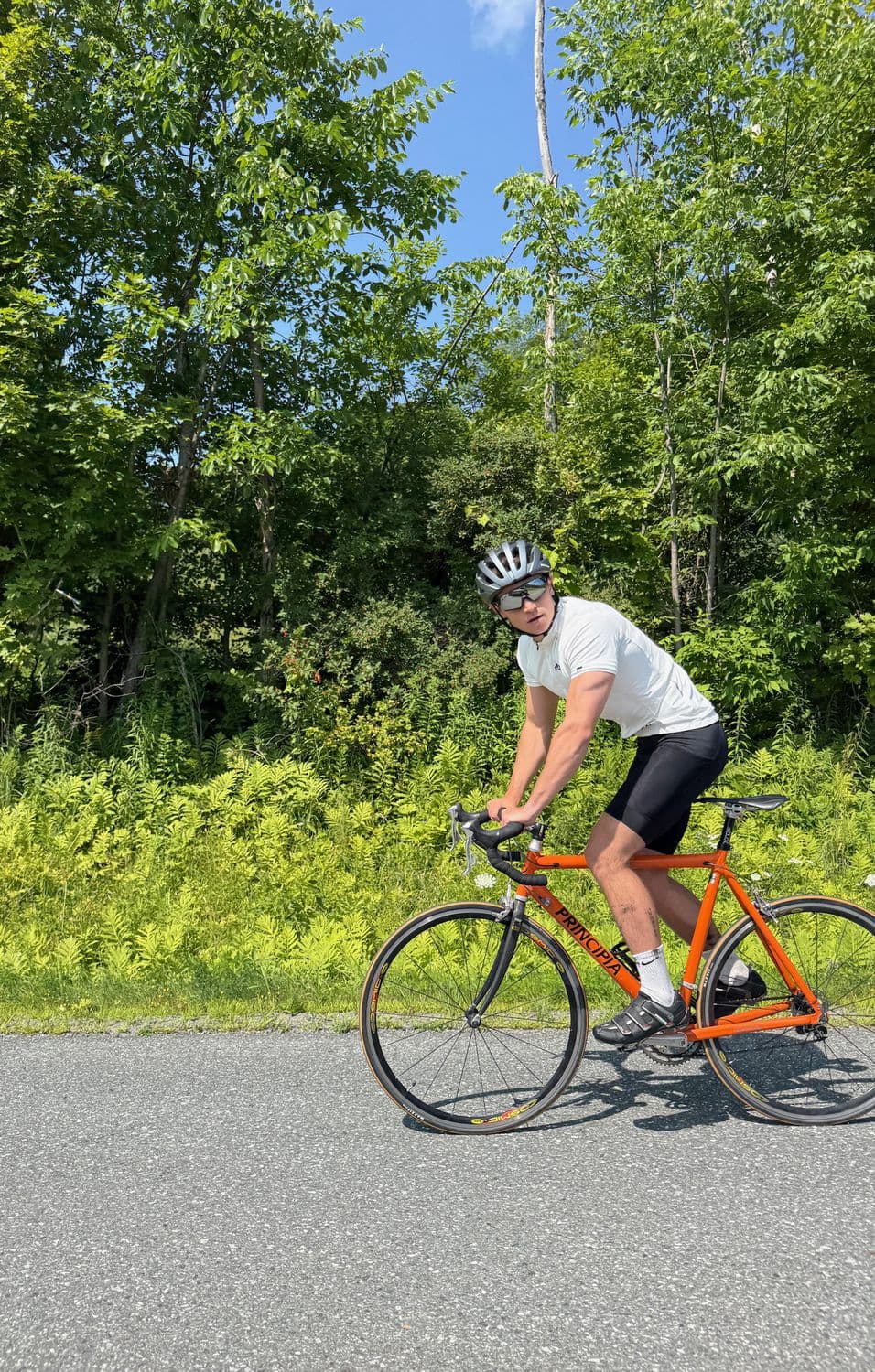 Judson riding on an open summer road