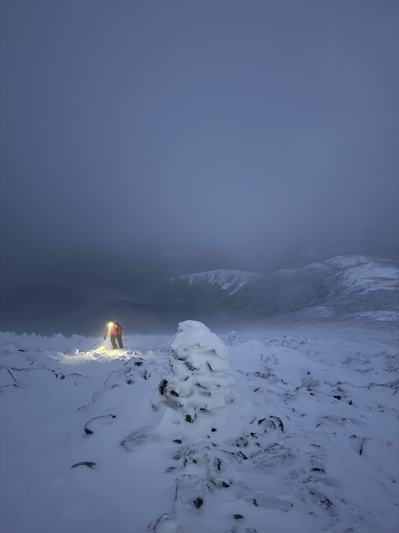 Judson on a summit in near-whiteout conditions